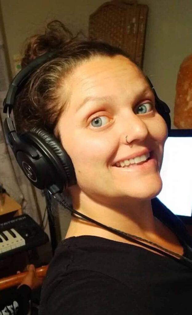 Carmella Louise with headphones on